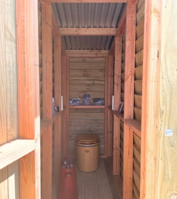 Inside the timber toilet room at Fossil Creek Farm Trust, a Bambooloo standing against the back wall