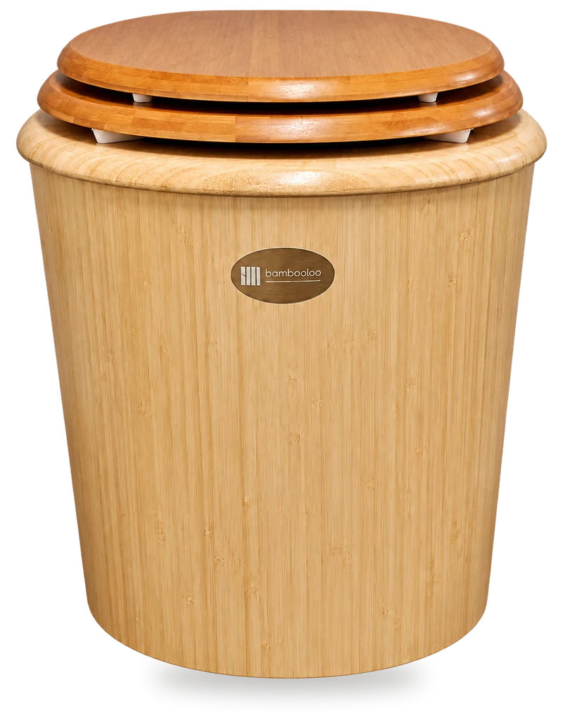 A Bambooloo Classic seen from the front: a tapered natural bamboo body with an oval bambooloo badge, under a darker seat and lid closed over small white stops